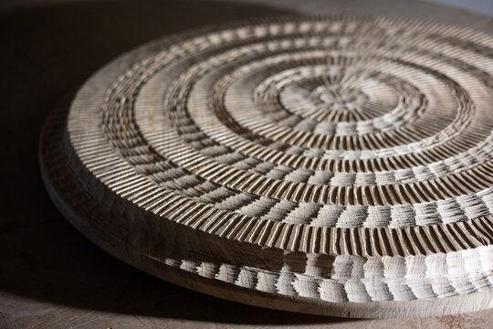 Carved wood table with lateral angle light with hard shadow texture