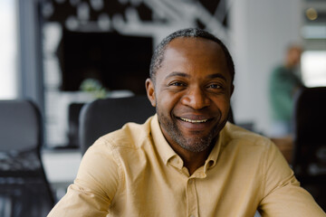 Positive employee eye contact sitting office