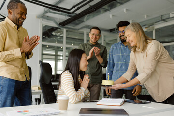 Happy multiracial coworker fun celebration