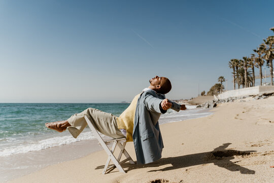 Fashion happy man at beach