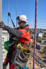 Rope access. Cleaning the windows of the skyscraper.
