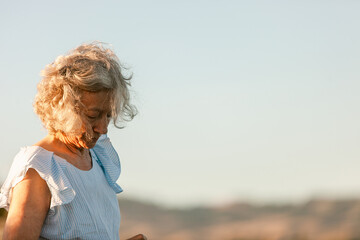 Senior woman by the field 