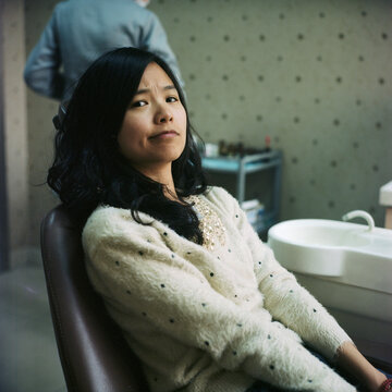 The strange expression on a woman's face before washing her teeth