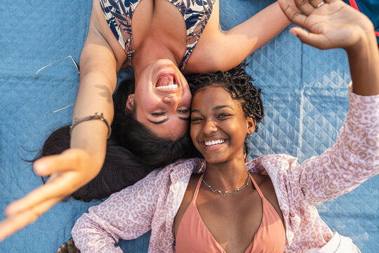 Happy grils having fun on beach