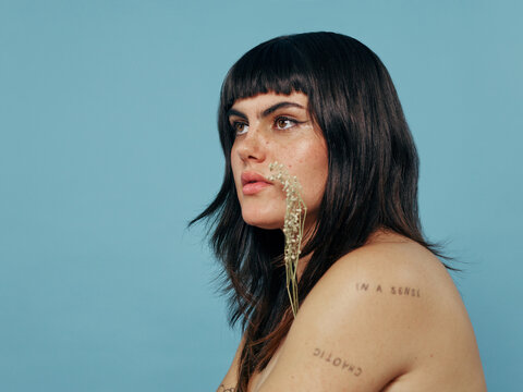 Natural beauty studio portrait with blue background