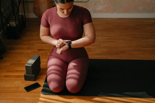 Sporty Woman Adjusting Smart Watch