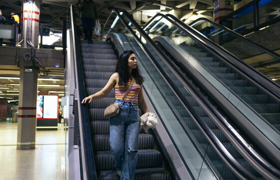 Woman entering subway station