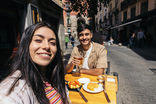 Couple eating spanish tapas and enjoying Madrid city
