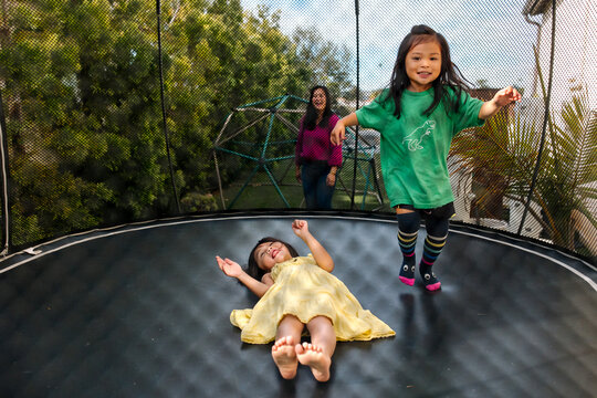 Children jumping together on a trampoline