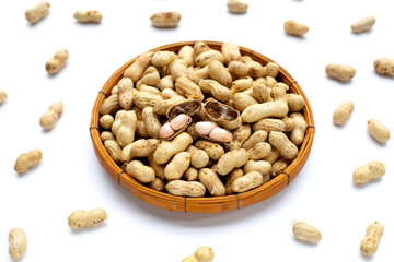 Raw peanuts on white background.