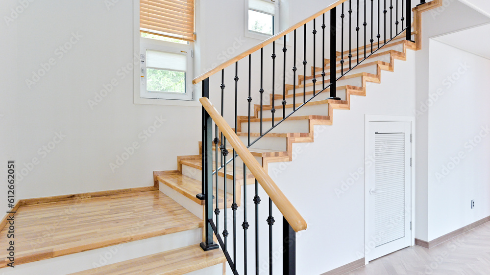 Wall mural bright and airy maple colored stairs