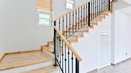 Bright and airy maple colored stairs