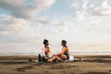 Two Friends chatting on the beach