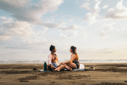 Two Friends chatting on the beach