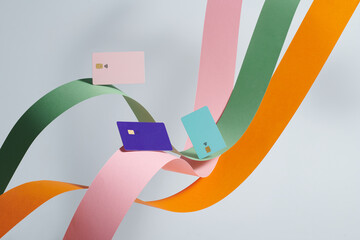 colorful bank cards floating on wave color paper lines