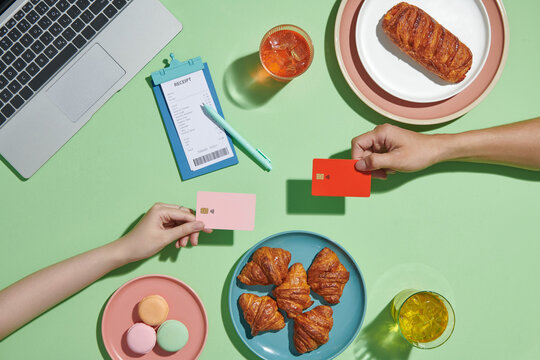 Female paying bill in cafe