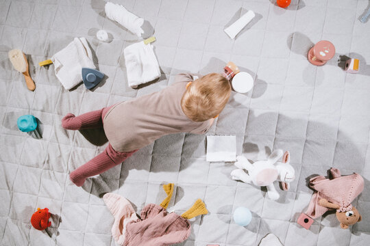 Baby and mess on floor.