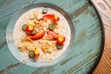 Oatmeal porridge with strawberries and almond