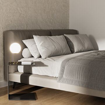 Close Up Of Bed And Bedside Table With Lamp And Book 