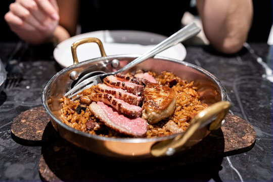 rice dish with duck and foie in restaurant
