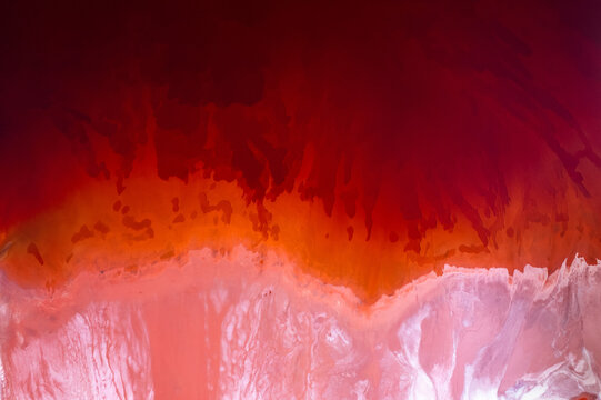 Abstract water on vibrant orange and red colors. Top view