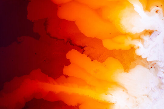 Abstract water on vibrant orange and red colors. Top view