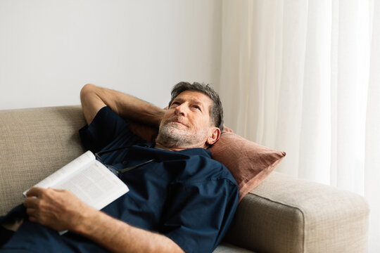 Man Relaxing on Couch at Home