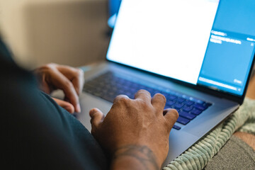 Person working on his laptop. 