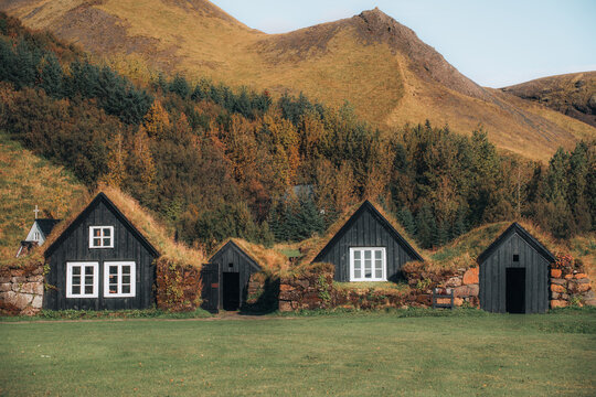 Grass-Roofed Houses In Iceland Among mountains 