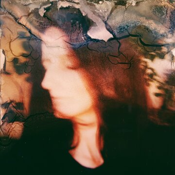 Damaged polaroid portrait of woman 