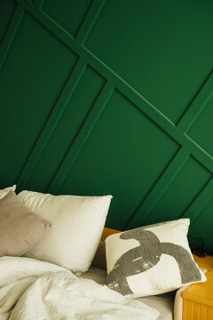 Pillows and Green Bedroom Wall