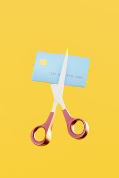 Scissors cutting debit / credit card. Reduce / pay off debt concept.