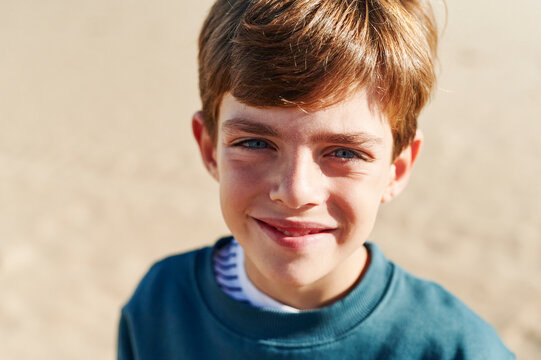 Smiling boy playing on a beach