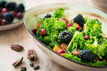 Blackberry, pumpkin and kale salad with pecans and cranberries