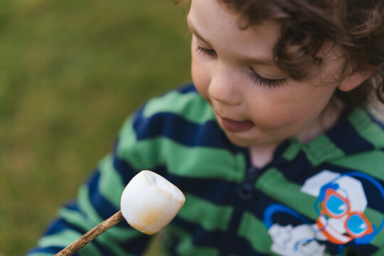 Little boy with marshmallow 