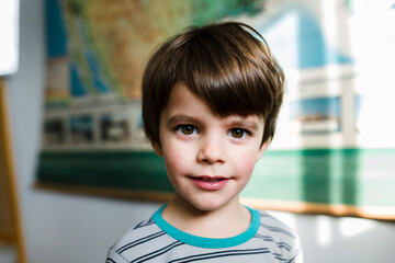 portrait of young boy in striped shirt