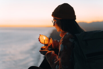 
Solitary hiker celebrates birthday atop mountain at sunset.