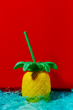 pineapple-shaped drink container on water