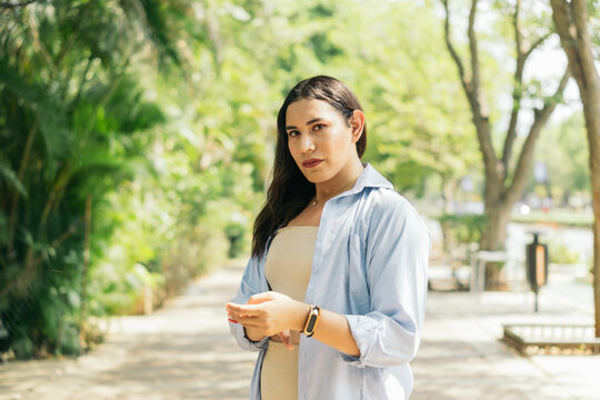 Portrait of a transgender person in the street.