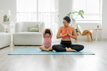 Young beautiful asian woman doing fitness exercise
