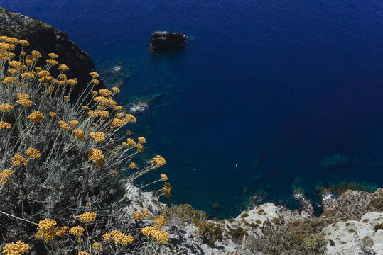 View from cliff to blue sea.