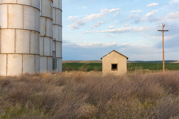 Stock image of abandoned farm structures at dusk