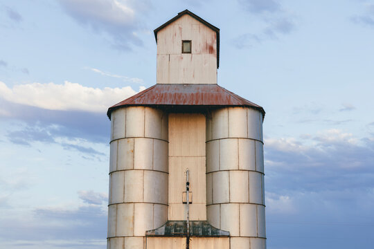 Stock image of abandoned grain silo, dusk