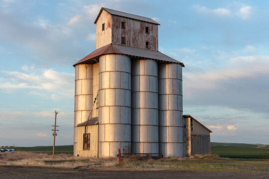 Stock image of abandoned grain silo, dusk