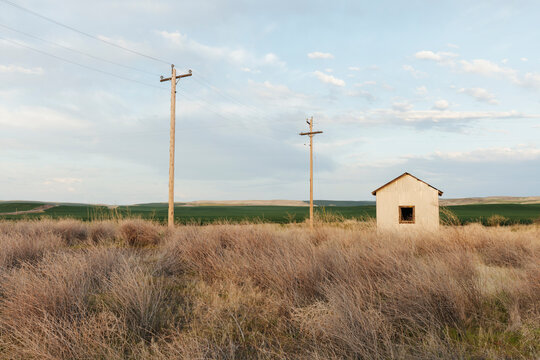 Stock image of abandoned farm structures at dusk