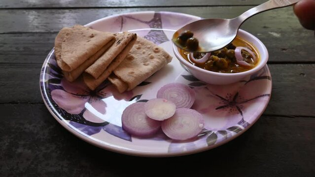 Chana Masala with Roti. Spicy Chickpeas is traditional North Indian main course recipe. It can be eaten in lunch, dinner and breakfast. Delicious indian food.
