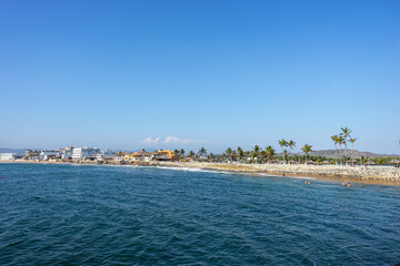 Fototapeta premium Boardwalk of Barra de Navidad beach, cihuatlan, Jalisco, mouth of river, Melaque Beach, Costalegre, cabo of mexico, bay of navidad.