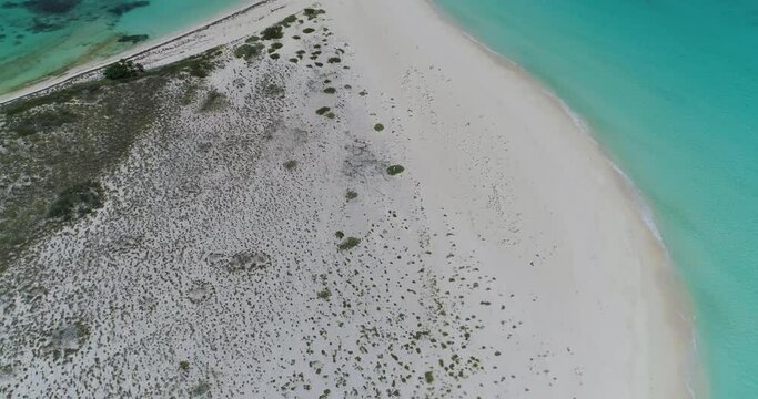 zenith tilit up reveal cayo de agua tropical island with turquoise water, aerial landscape.