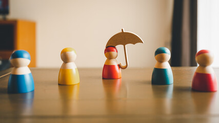 Umbrella icon and people model. Security protection and health insurance. The concept of family...