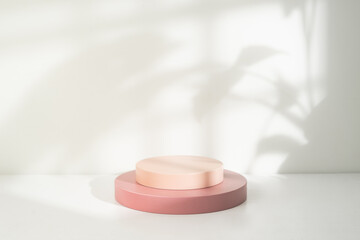 Minimalist podium on white room with natural shadow overlay